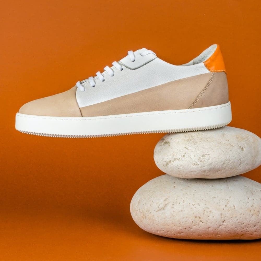 Fall Limited Edition Sneakers impossibly balanced on rocks